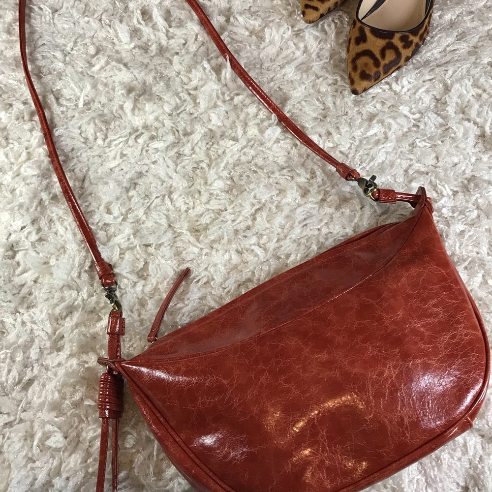 ANTHROPOLOGIE- RUST COLORED CROSSBODY PURSE WITH SIDE TASSEL & REMOVABLE STRAP